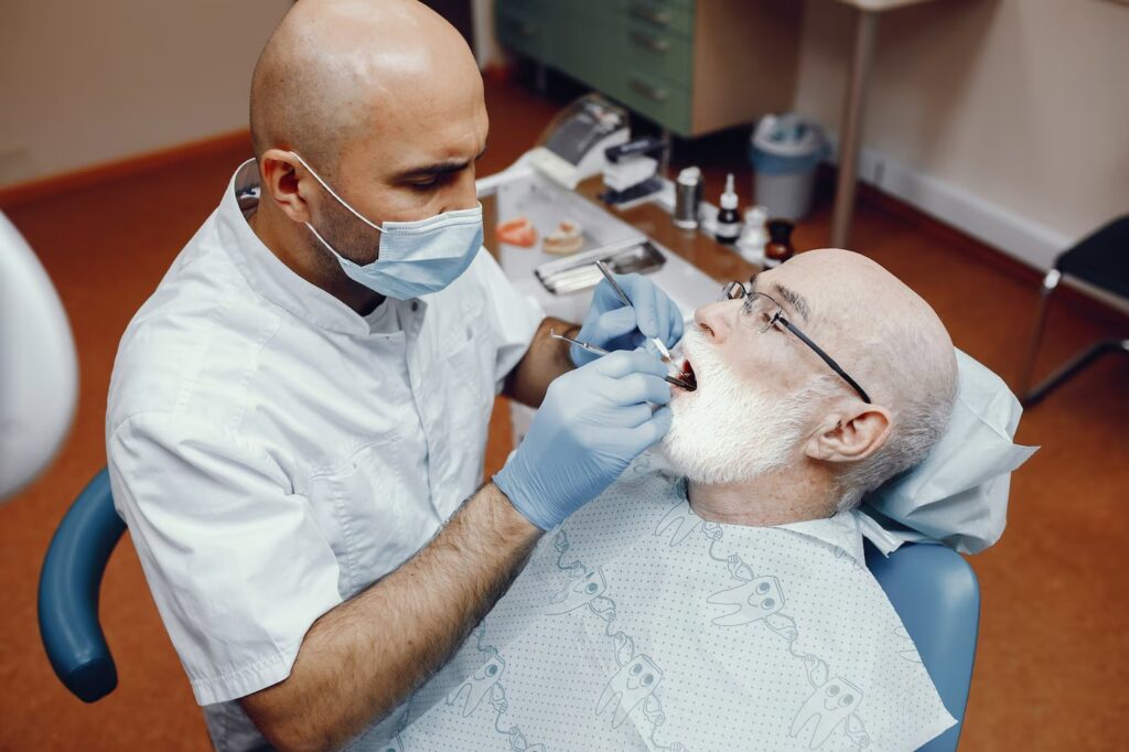Dental implant specialist in Fremont CA reviewing full mouth dental implant options with a patient at Apollo Dental
