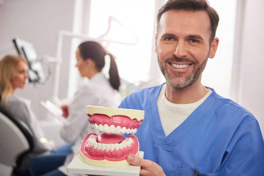 Apollo Dental Fremont team showing implant supported denture compared to traditional dentures for full arch patients